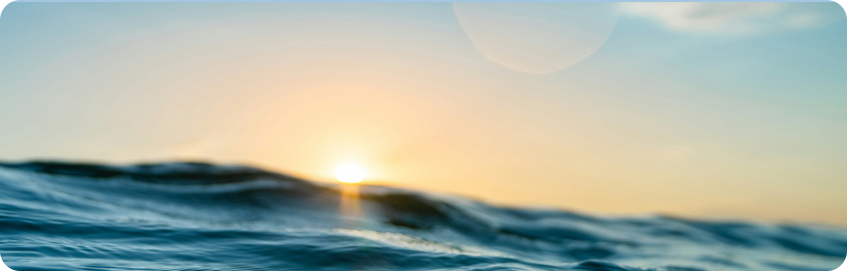 photo of sun shining on the ocean